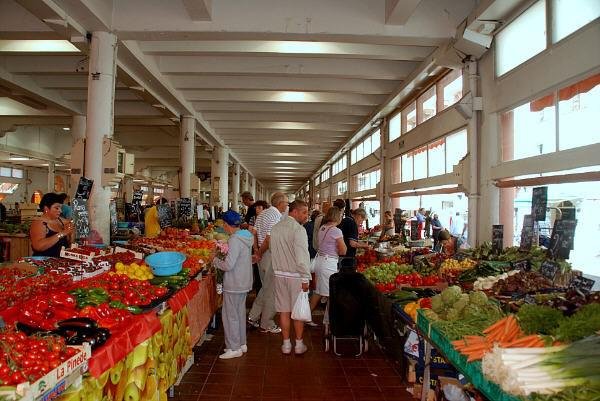Fresh produce stalls inside Forville Market in Cannes